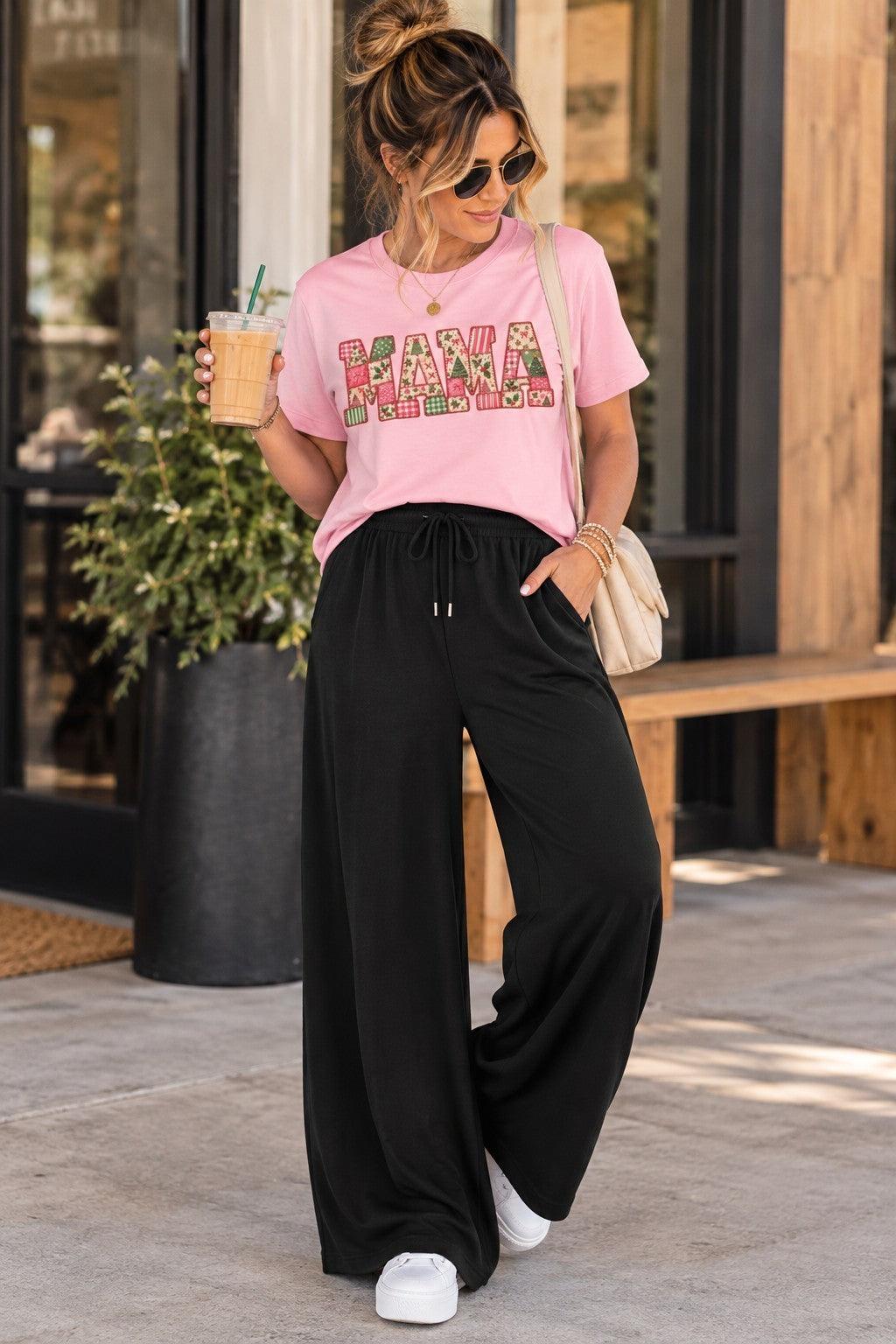 ChalkboardxChaos black wide-leg lounge pants with drawstring waist worn by a woman with a pink graphic t-shirt