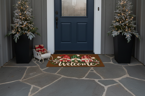ChalkboardxChaos Christmas gnome welcome doormat with festive red and green hats on a stone porch entryway