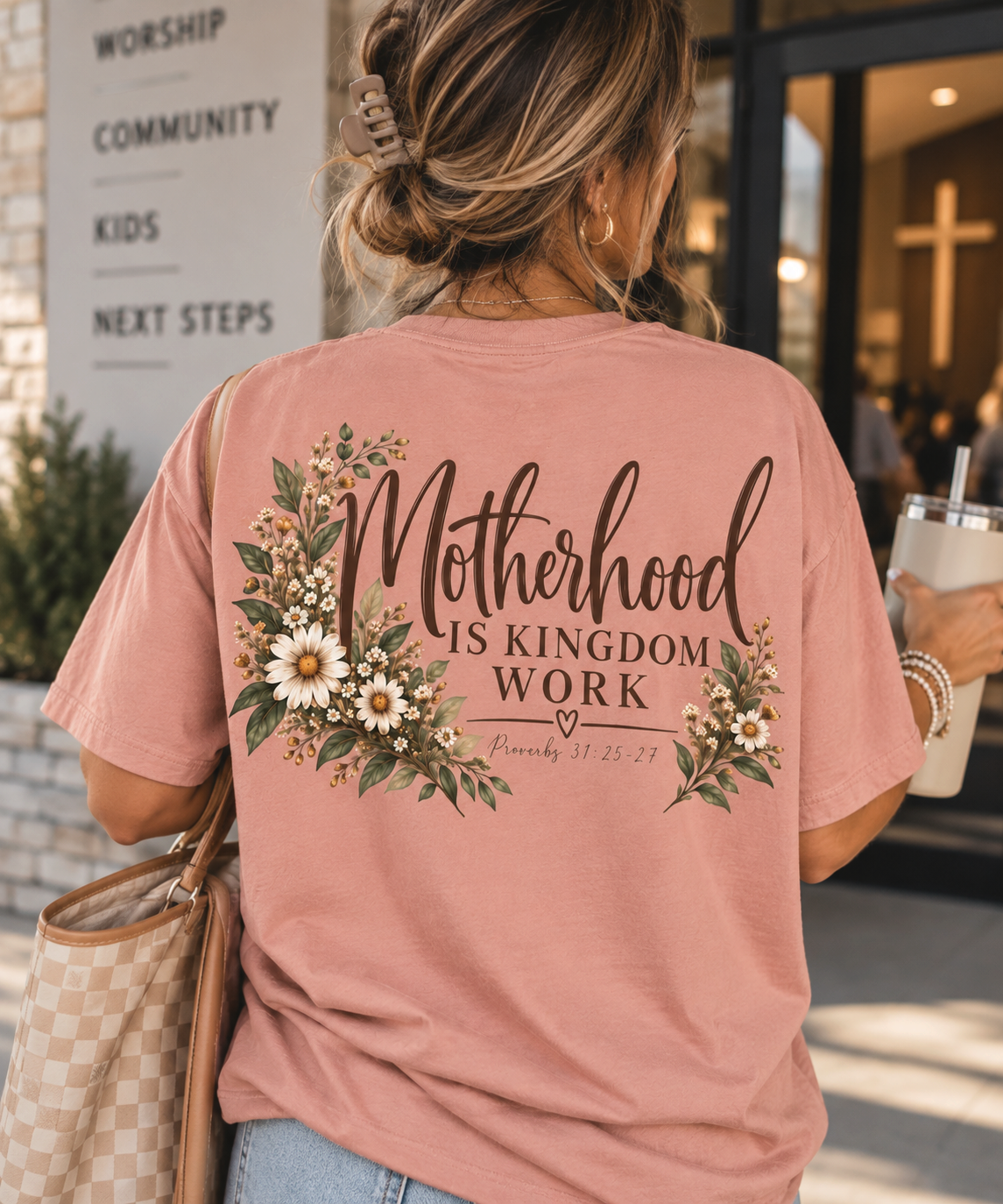 ChalkboardxChaos dusty rose graphic tee with Motherhood Is Kingdom Work text and botanical floral design on the back