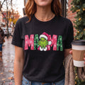 ChalkboardxChaos Grinch Mama Christmas graphic tee in black with pink and green snowflake lettering and Santa hat.