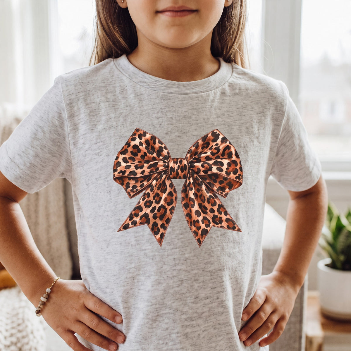 ChalkboardxChaos kids t-shirt in heather grey featuring a large leopard print bow graphic in caramel and black tones