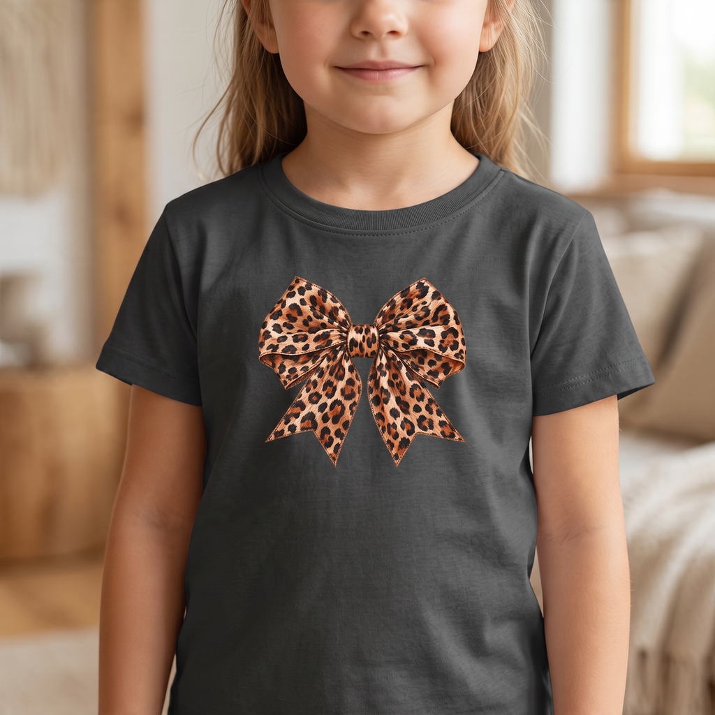 ChalkboardxChaos kids grey t-shirt featuring a trendy leopard print bow graphic in caramel and black tones.