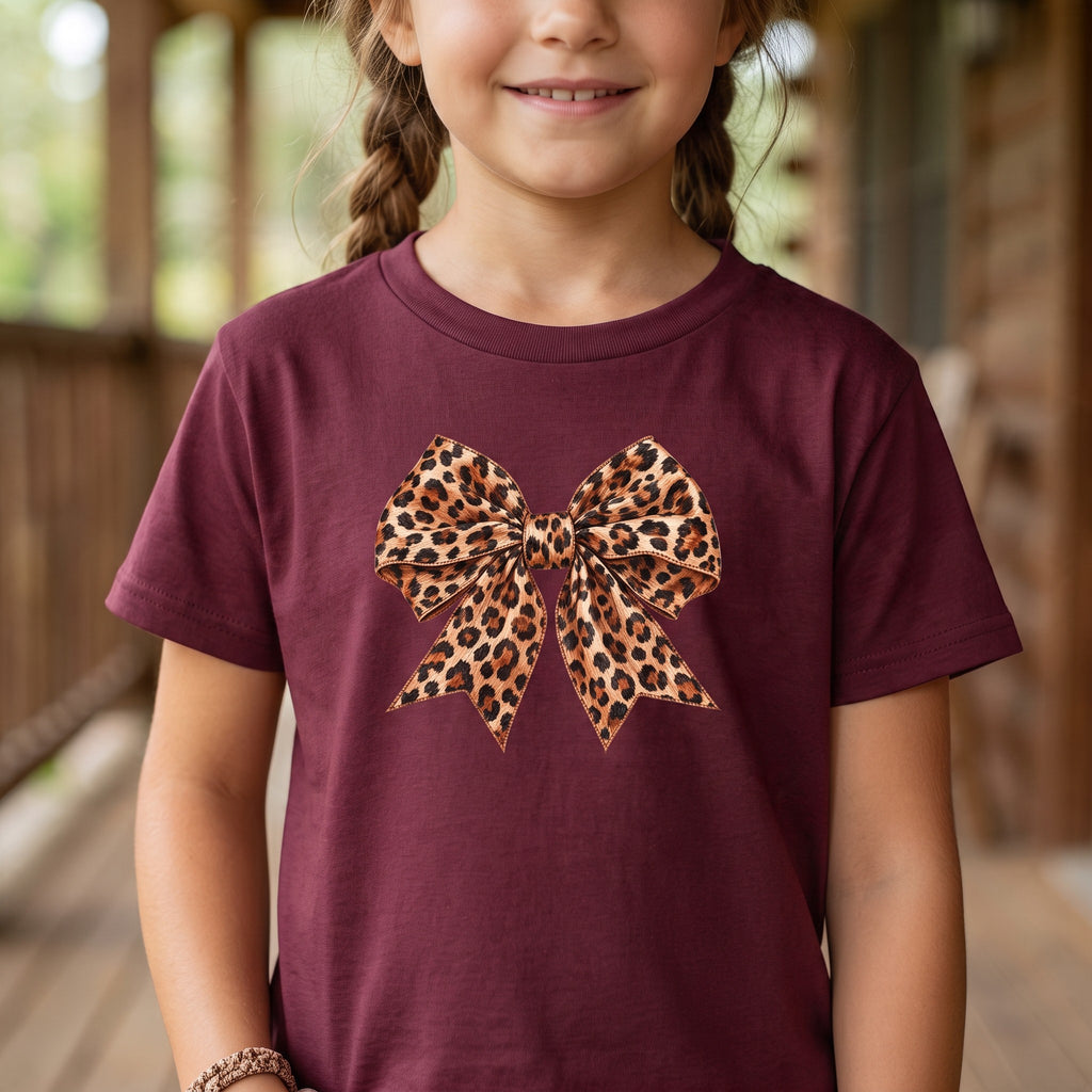 ChalkboardxChaos maroon t-shirt for girls featuring a large leopard print bow graphic on the front