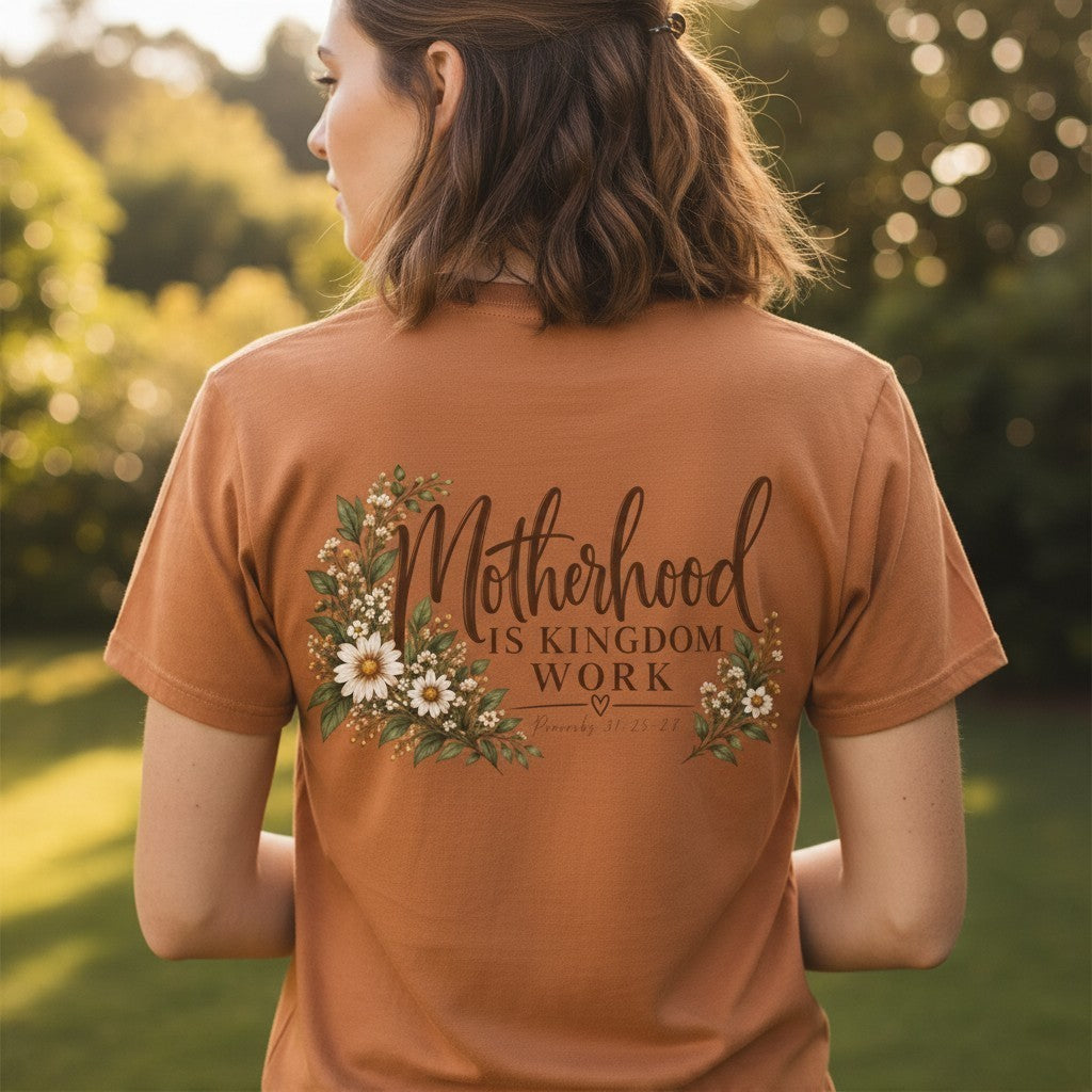 ChalkboardxChaos dusty rose graphic tee with Motherhood Is Kingdom Work text and floral botanical design on the back
