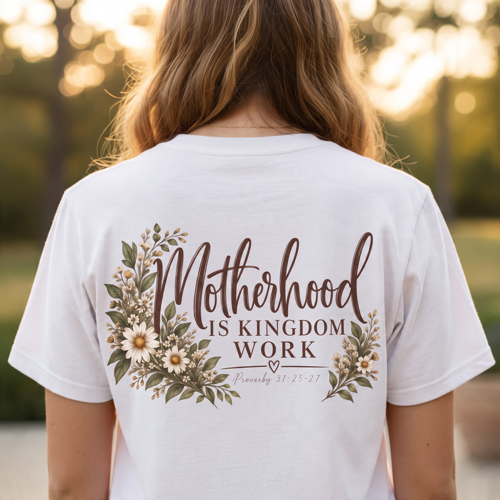 ChalkboardxChaos white graphic tee featuring Motherhood Is Kingdom Work text with botanical floral and daisy design