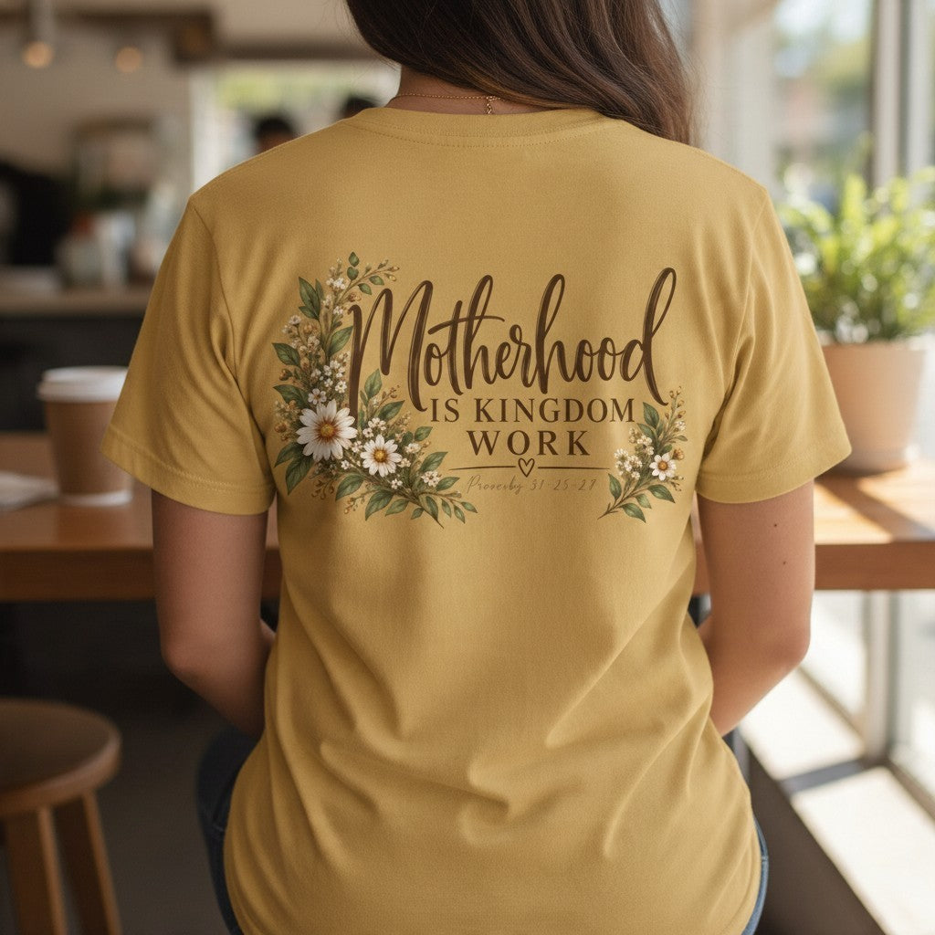 ChalkboardxChaos mustard yellow graphic tee featuring Motherhood Is Kingdom Work text with botanical floral design
