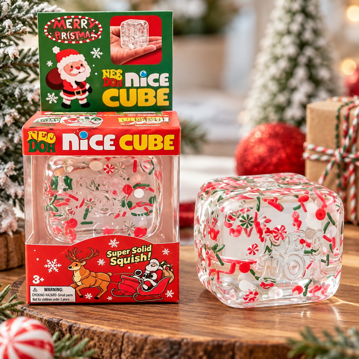 ChalkboardxChaos NeeDoh Christmas Nice Cube sensory toy with red and green holiday confetti inside a clear squishy cube.