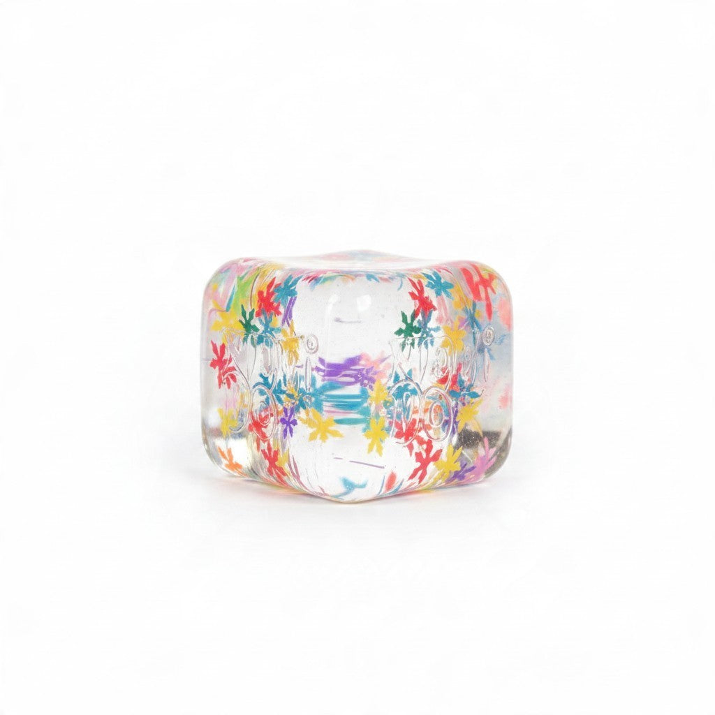 ChalkboardxChaos NeeDoh Nice Wow Cube Flake sensory fidget toy with colorful confetti inside a clear squishy cube.
