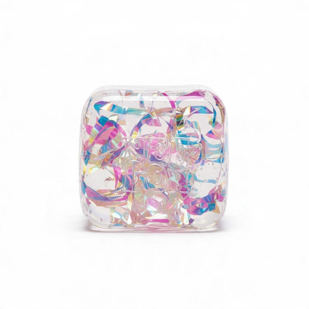 ChalkboardxChaos NeeDoh holographic ribbon squishy cube with iridescent metallic strips inside a clear sensory toy