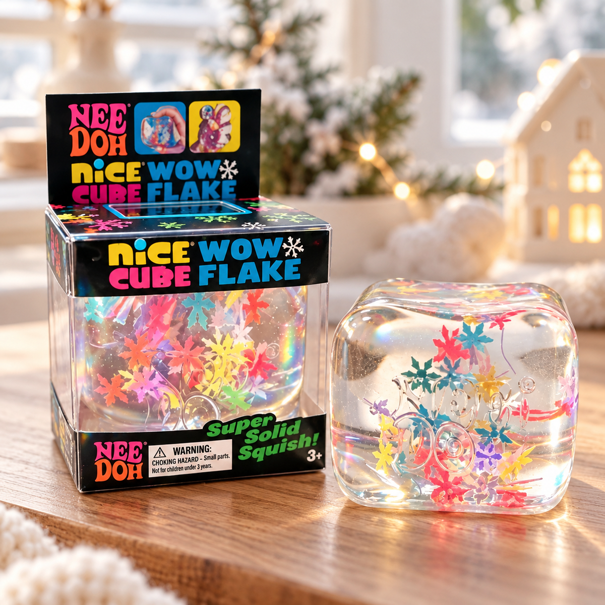 ChalkboardxChaos NeeDoh Nice Wow Cube Flake sensory toy with colorful snowflake confetti inside a clear squishy cube.