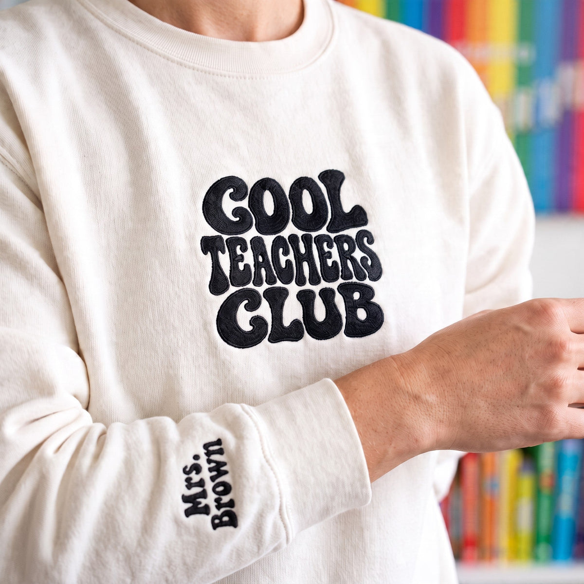ChalkboardxChaos cream sweatshirt with Cool Teachers Club embroidered in black retro bubble font and personalized wrist