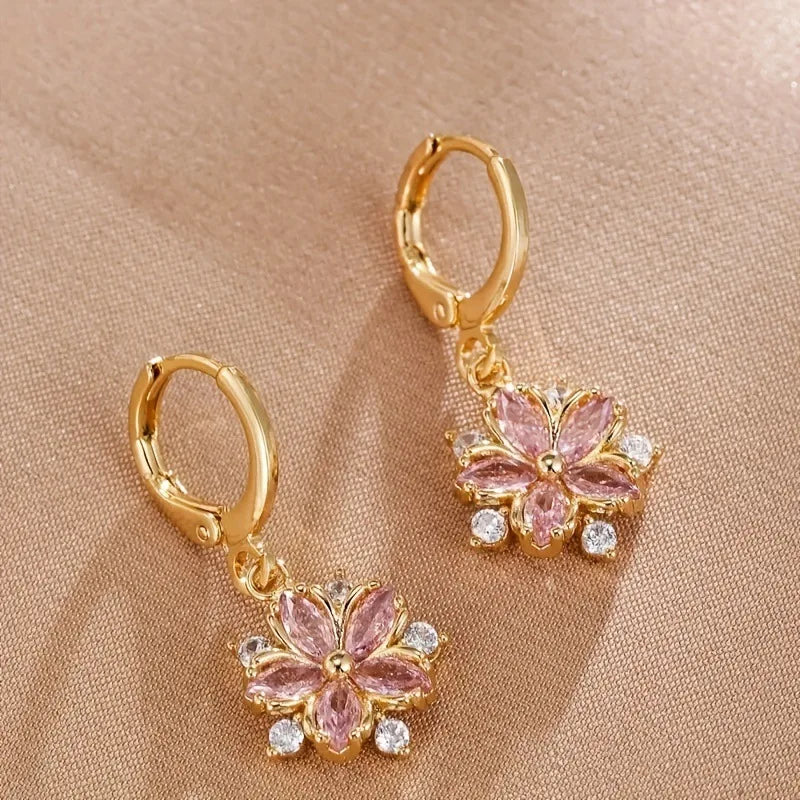 ChalkboardxChaos gold hoop earrings with pink marquise-cut crystal flower pendants and clear stone accents.