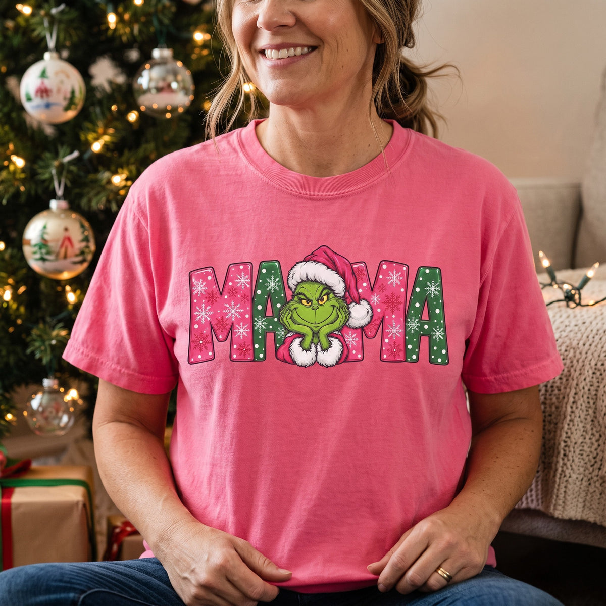 ChalkboardxChaos pink Grinch Mama Christmas t-shirt with festive green and pink snowflake graphic and Santa hat.