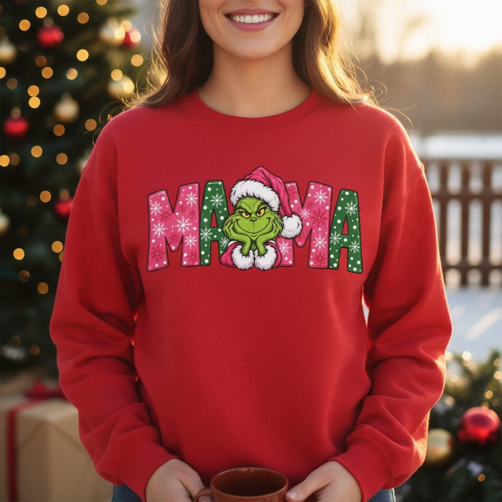 ChalkboardxChaos red Grinch MAMA sweatshirt with festive pink and green snowflake lettering and a Grinch Santa design.