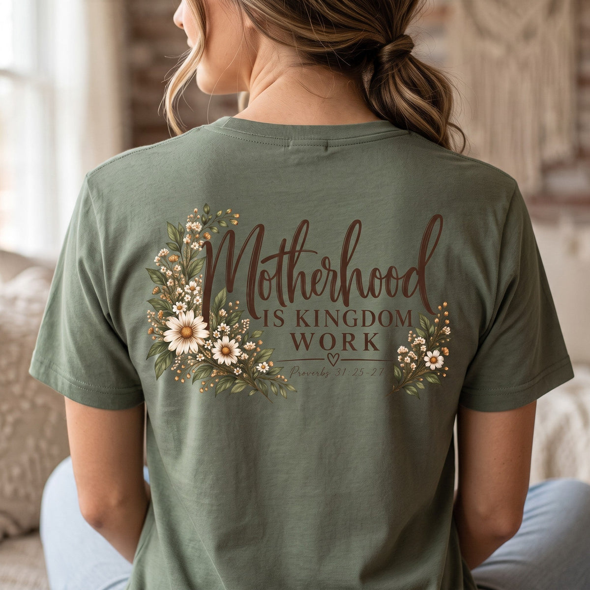 ChalkboardxChaos sage green Christian graphic tee featuring botanical floral art and Motherhood Is Kingdom Work text.