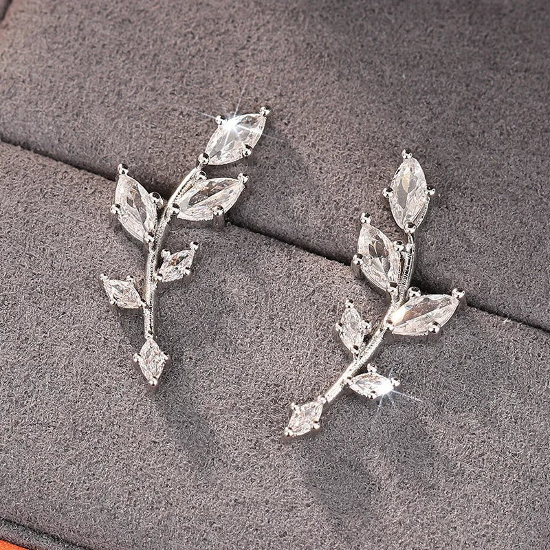 ChalkboardxChaos silver-tone crystal branch earrings with marquise-shaped stones in a nature-inspired design